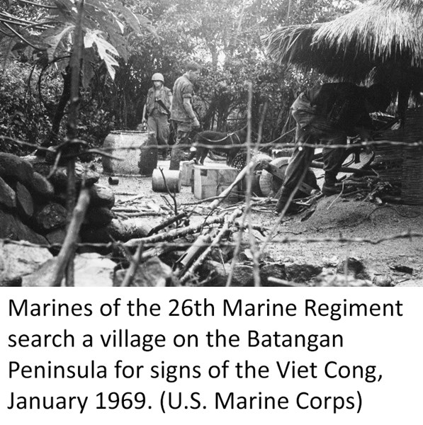 Marines of the 26th Marine Regiment search a village on the Batangan Peninsula for signs of the Viet Cong, January 1969. (U.S. Marine Corps)